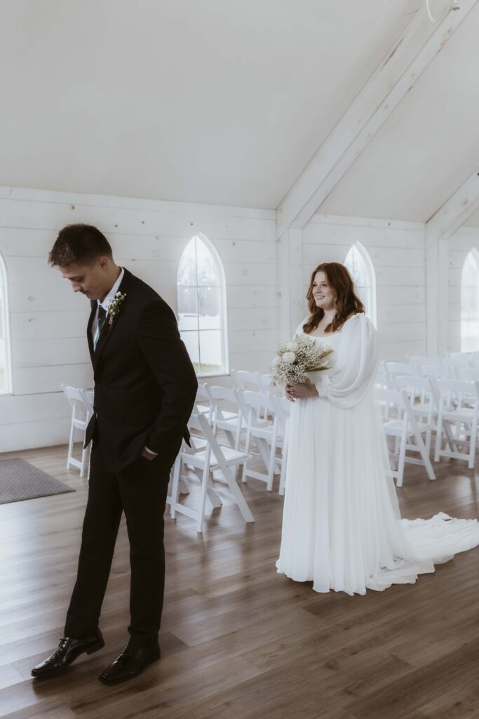 Groom anxious with sweet emotion before seeing his bride for the first time before the ceremony.