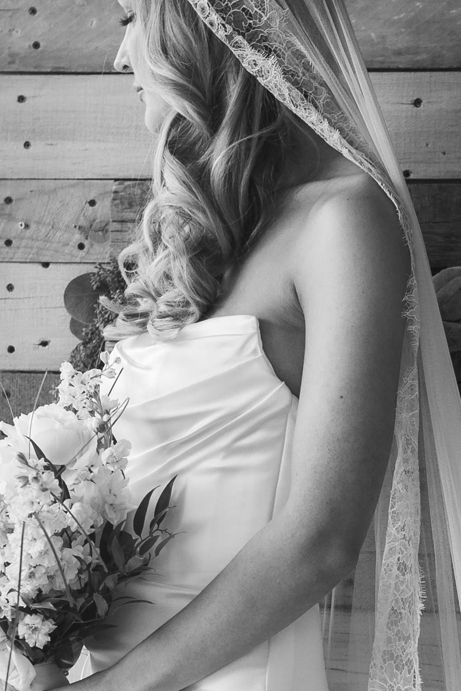 Black and white bridal portrait highlighting the wedding dress, photographed in the 417 area.