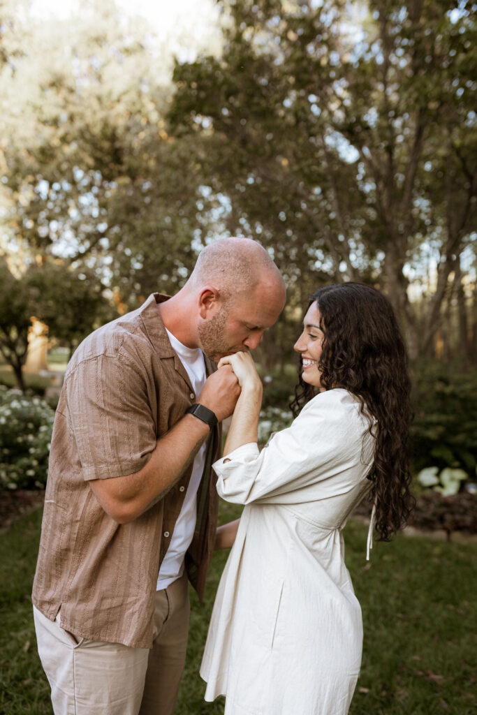 Playful and romantic engagement photos of a couple at Nathanael Greene Park in Springfield, Missouri