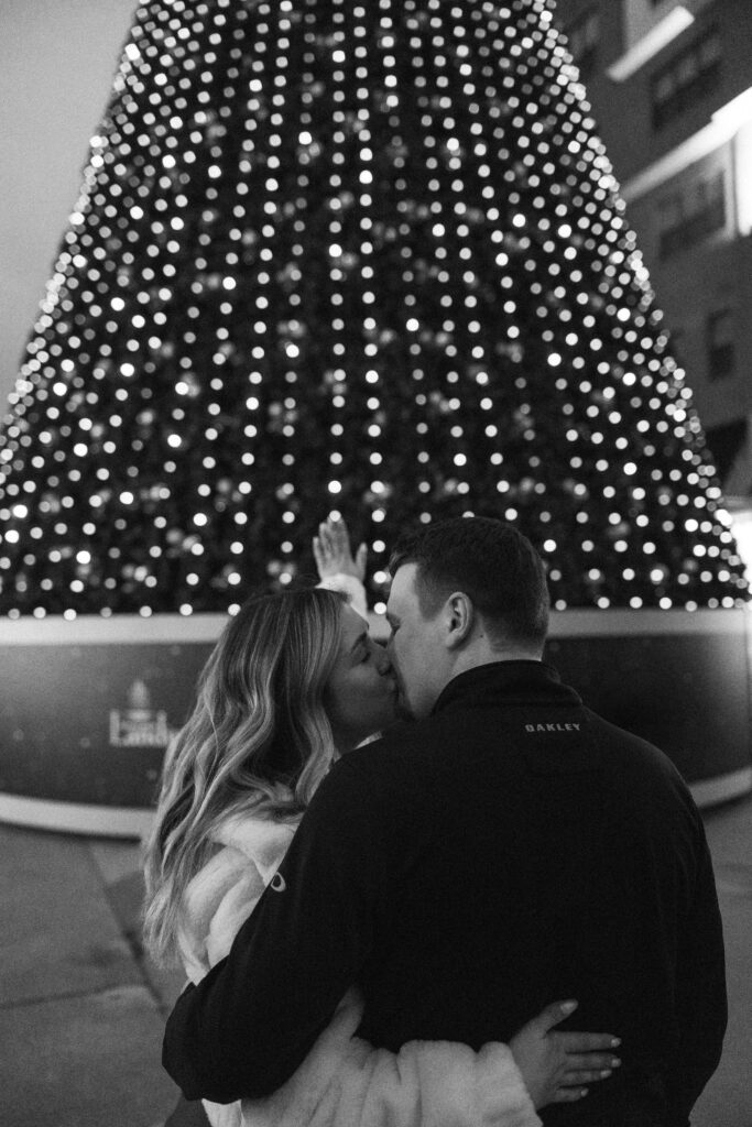 Christmas proposal at Branson Landing in front of the Christmas tree