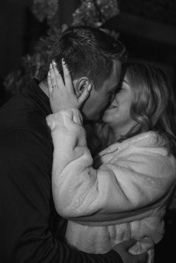 Christmas proposal at Branson Landing in front of the Christmas tree