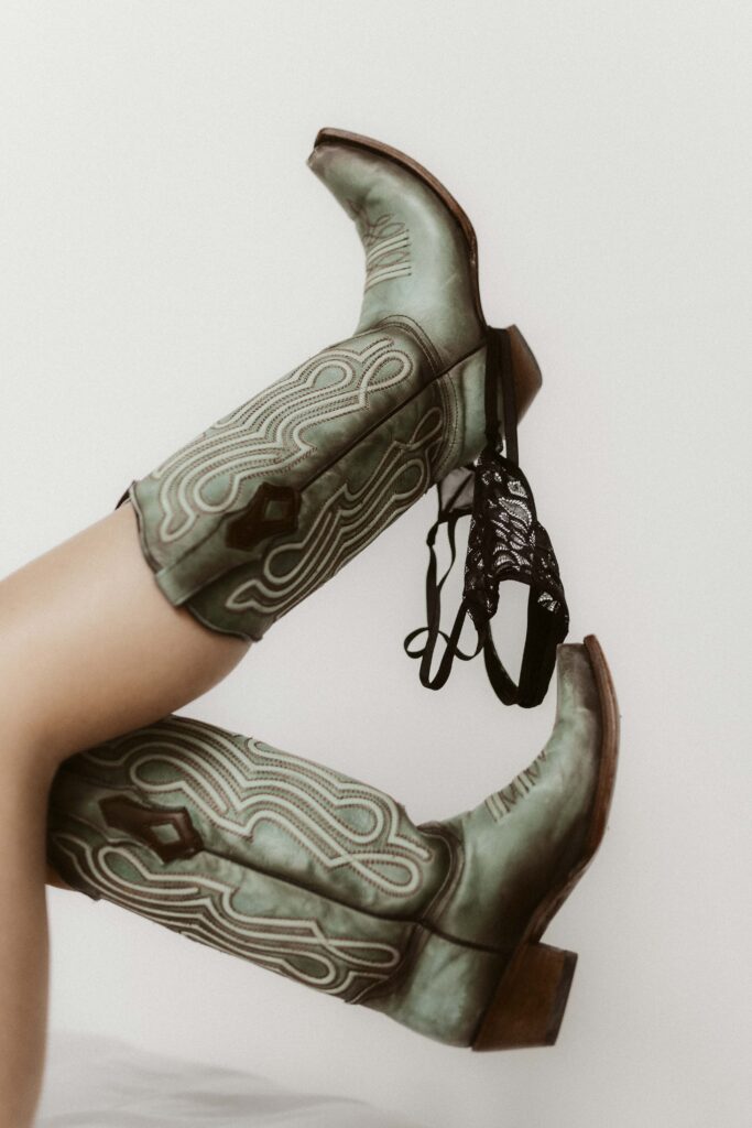 Bride posing during elegant bridal boudoir photography session in Missouri.