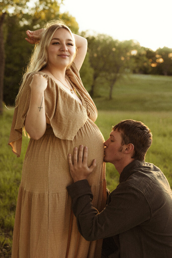 Emotive couple maternity session in Missouri showing connection between expecting parents during golden hour outdoor photography.