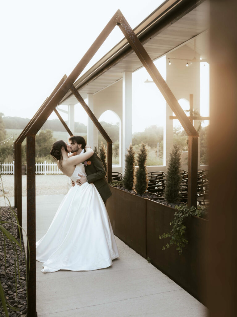 Bride and groom share an intimate moment during golden hour at Spring Valley in Strafford, Missouri