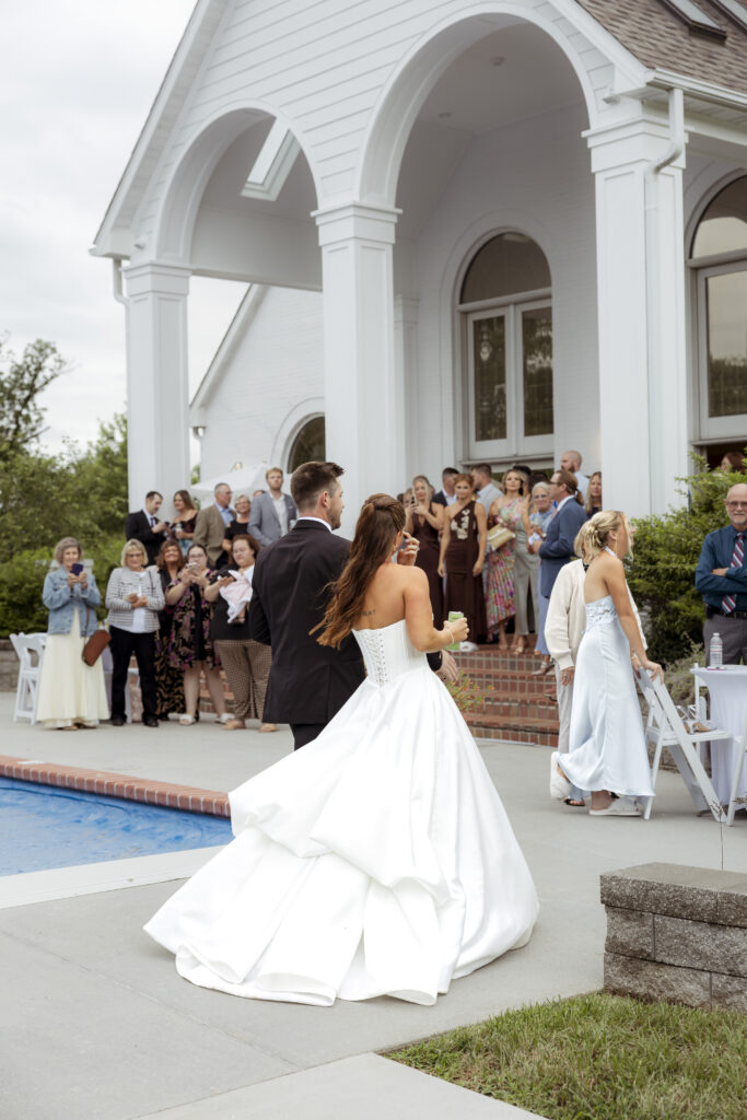 Wedding guests enjoying poolside cocktail hour at The Callaway Jewel in Fulton, Missouri